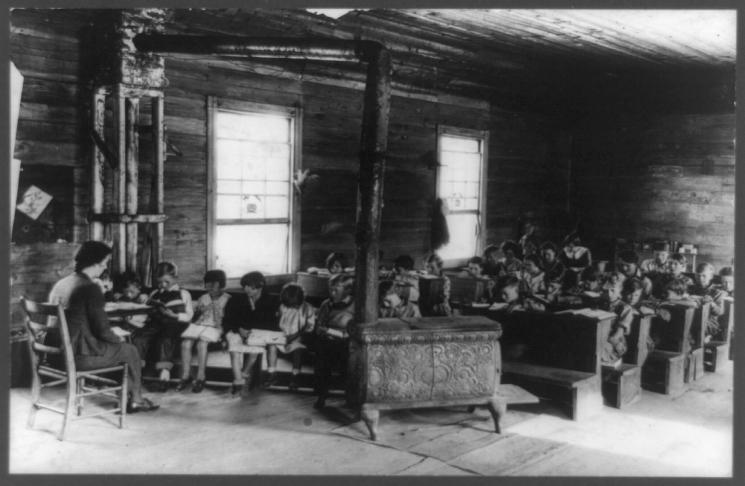 [The Interior of a little red schoolhouse with teacher and students, Crossville, Tennessee], [between 1933 and 1936] — historic photograph