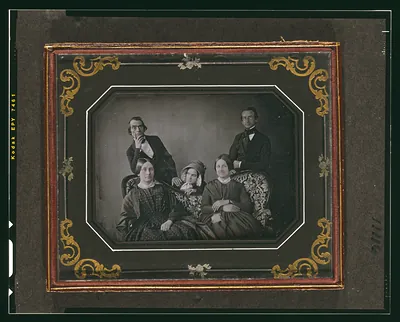 Daguerreotype group portrait of five people in gilt frame