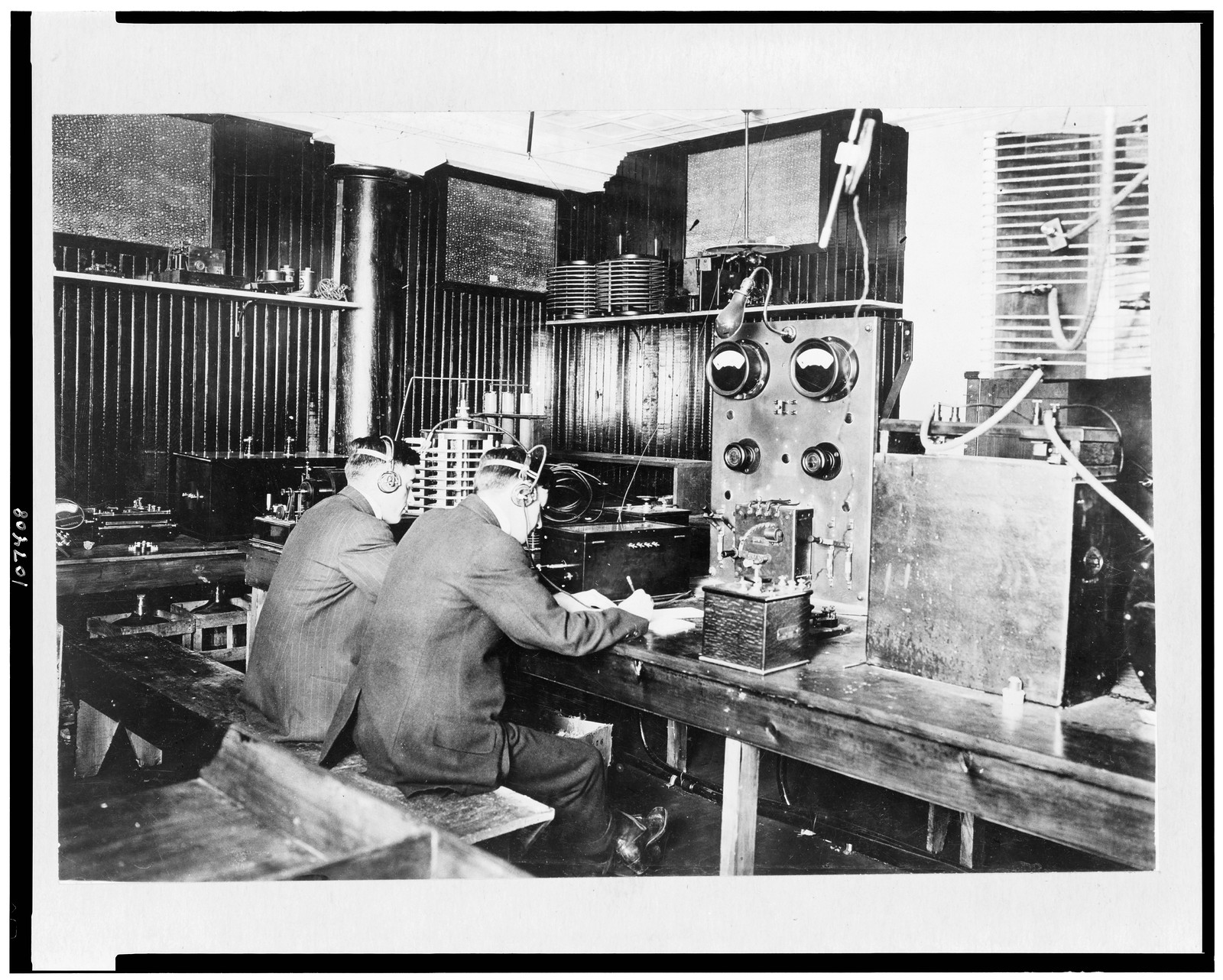 [Marconi wireless school, New York. Operators copying messages transmitted from ships at sea], c1912. — historic photograph
