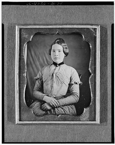 Seated woman in striped dress, daguerreotype portrait