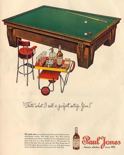 Paul Jones whiskey advertisement beside pool table