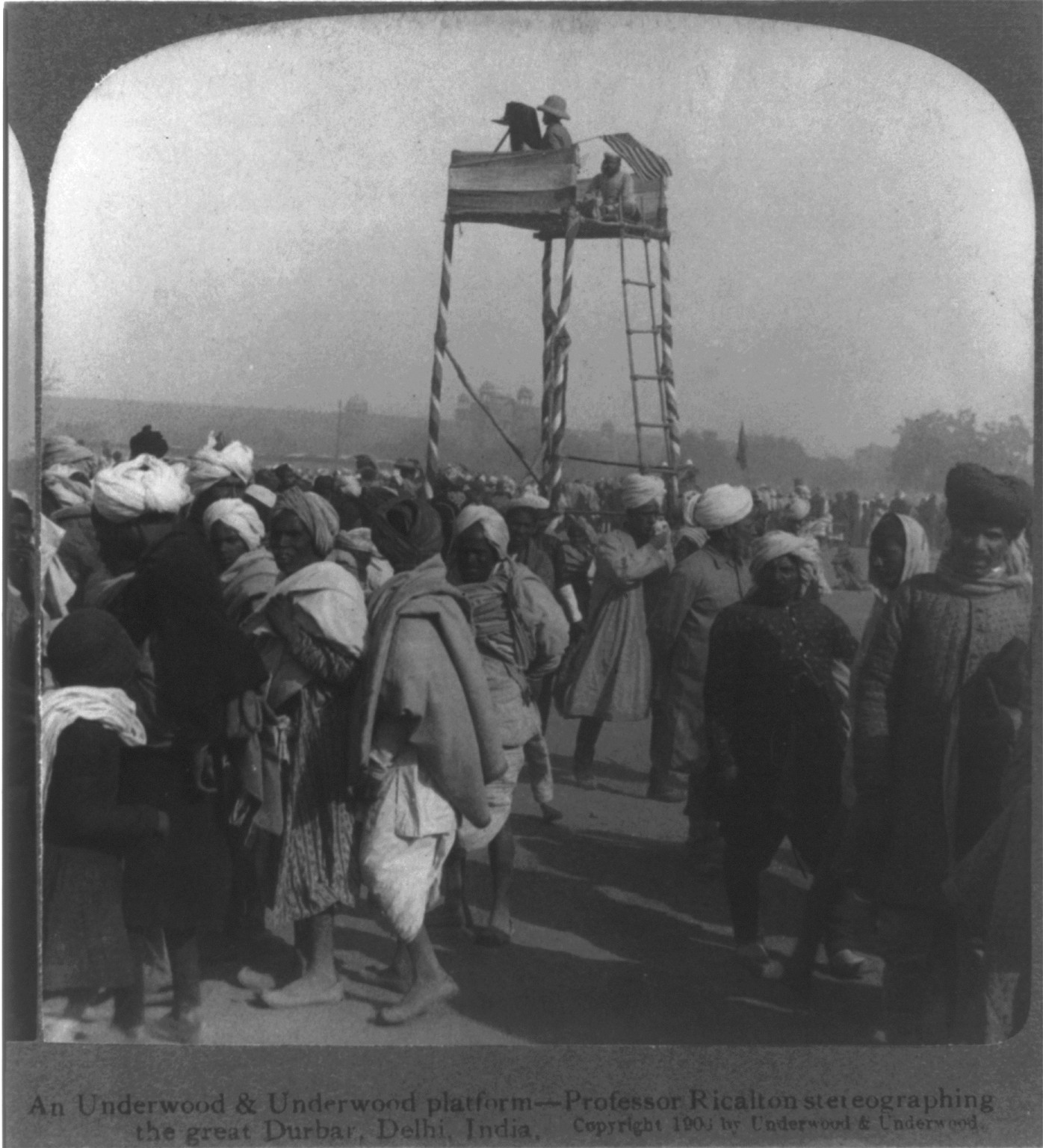 An Underwood & Underwood platform - Professor [James] Ricalton stereographing the great Durbar, Delhi, India, c1903. — historic photograph