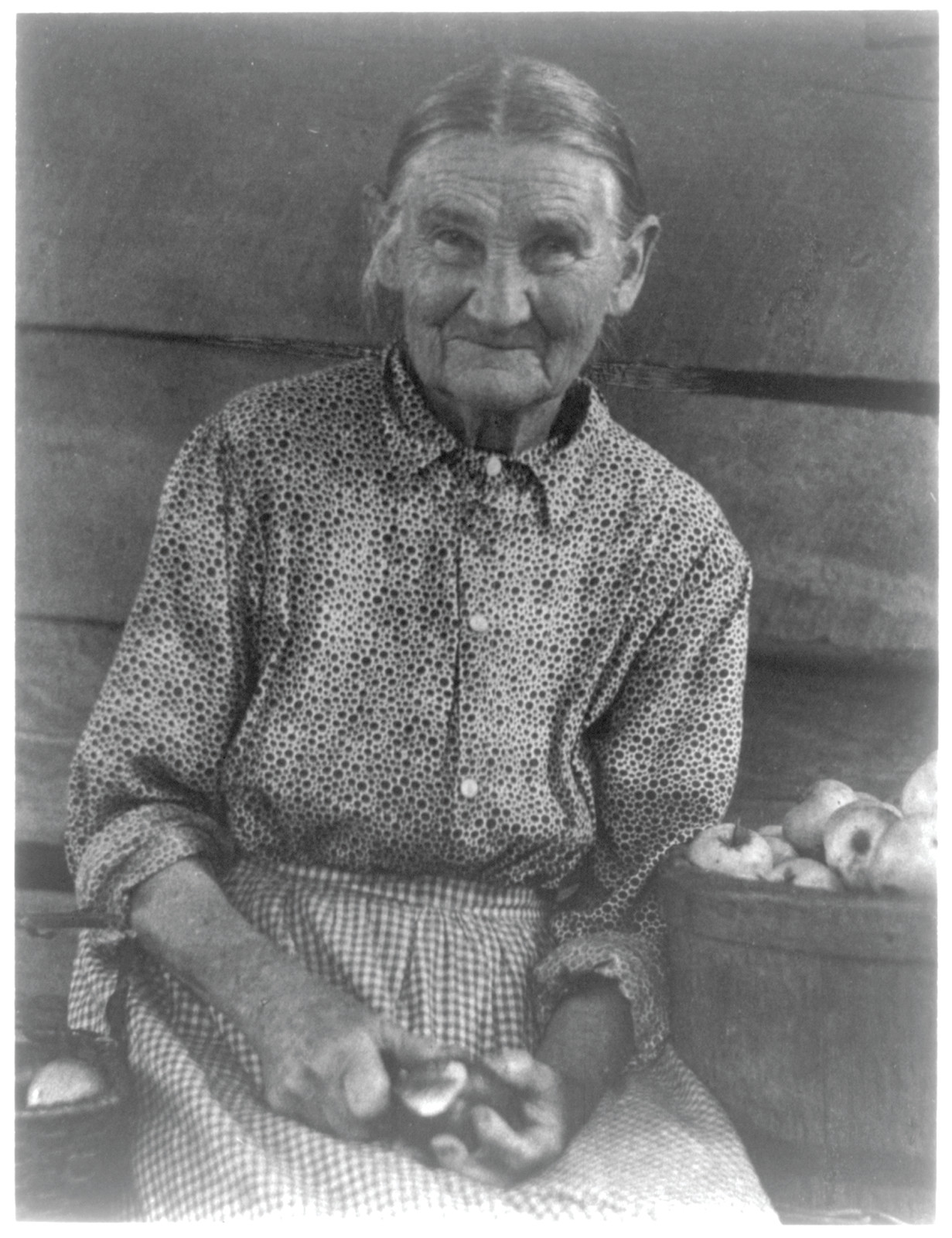 Woman Paring Apple, No. 1. Doris Ulman, photographer, c. 1930 — historic photograph