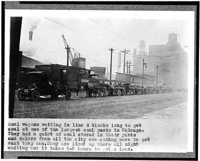 Coal wagons waiting in line 6 blocks long to get coal at one of the largest coal yards in Chicago ...