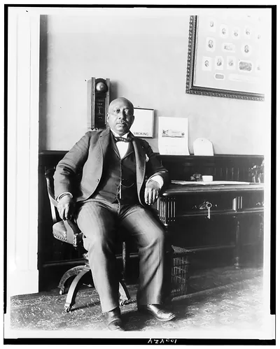 [Arthur Simmons, White House staff member, seated in office lobby of the White House]