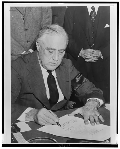 President Roosevelt signs declaration of war