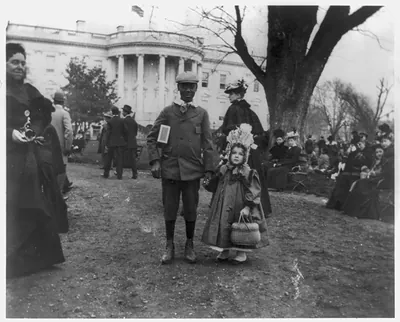 [D.C. Wash. - White House - Negro boy holding hand of small white girl during Easter egg roll]