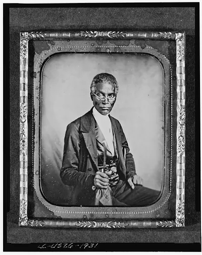 [Philip Coker, three-quarter length portrait, full face, seated, wearing spectacles]