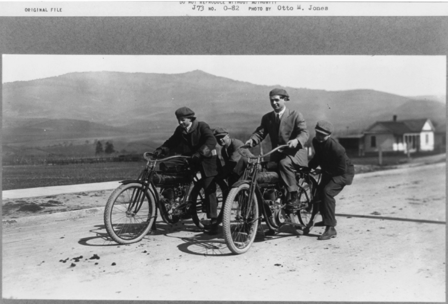[Two men on motorcycles at the start of a race with two men supporting the motorcycles, near Boise, Idaho], [ca. 1911] — historic photograph