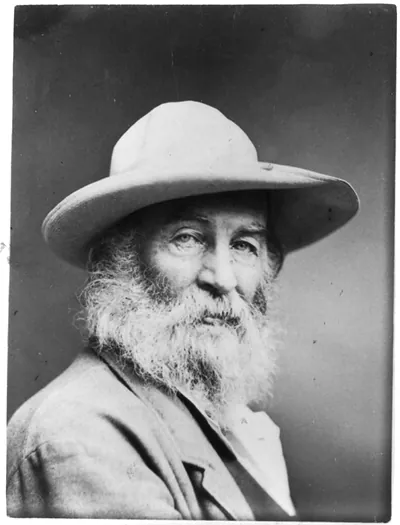 [Walt Whitman, head-and-shoulders portrait, facing front, wearing hat]
