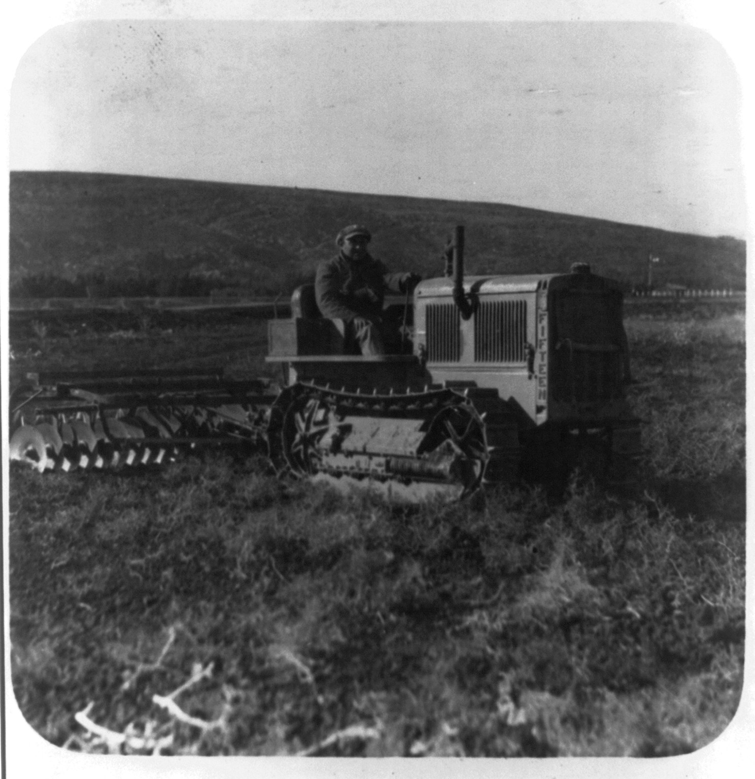[Tractor disc plowing. On the great stretches of Esdraelon], [between 1920 and 1933] — historic photograph