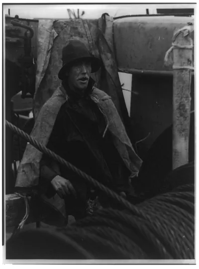 The winch hand prepares to unload