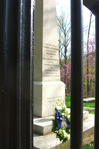 Thomas Jefferson's tombstone behind iron gate with wreath