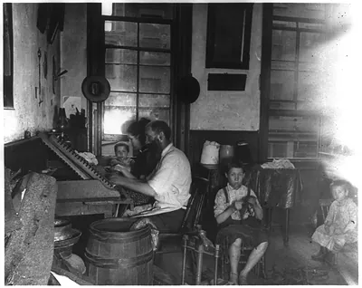 Bohemian cigarmakers at work in their tenement
