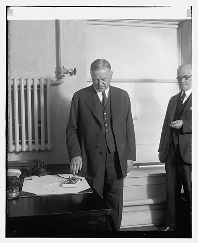 Hoover presses button to start machinery in new Bldg. Detroit News, 12/6/29