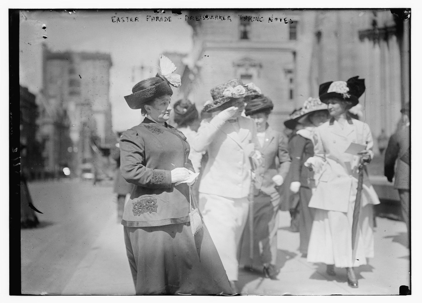 Easter Parade, dressmaker taking notes, n/a — historic photograph