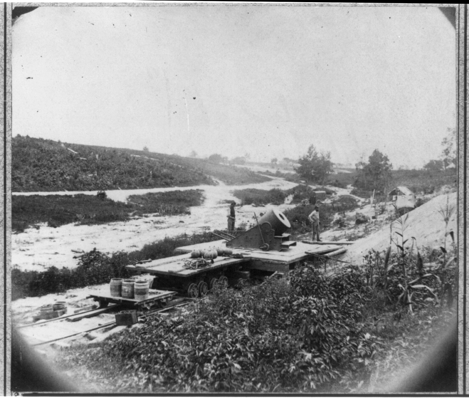 [13 inch mortar Dictator" in front of Petersburg VA mounted on railroad car]", [no date recorded on caption card] — historic photograph