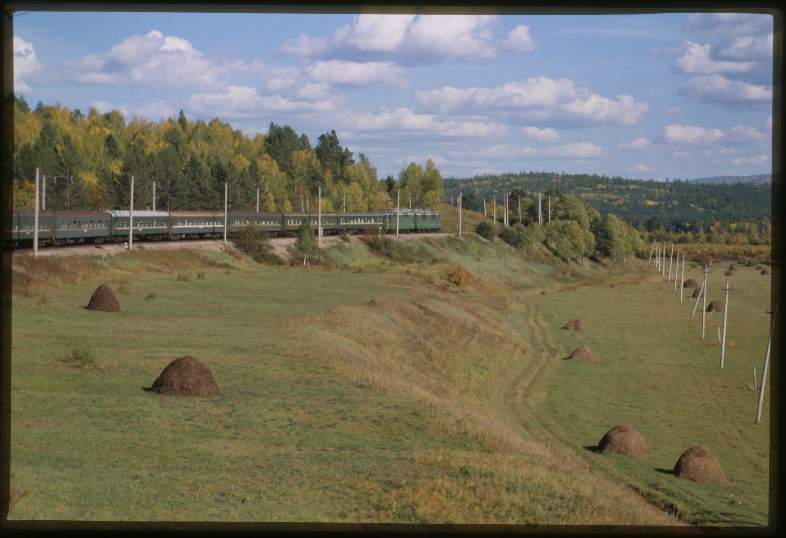 [Trans-Siberian Express speeds eastward beside mountain stream toward Vladivostok] — historic photograph