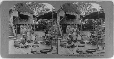 Philippine Islands: Natives winnowing rice by hand, Pandacan