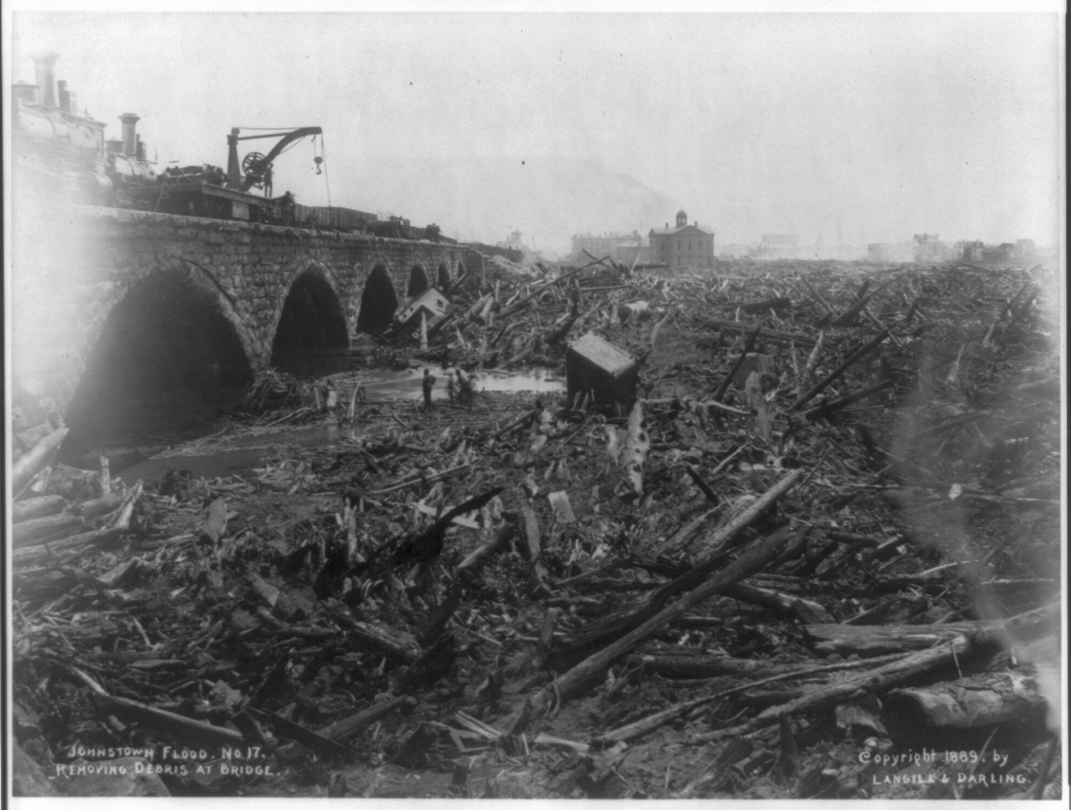 [Johnstown Flood (Johnstown, Pa. 1889). Removing debris at bridge, no. 17] — historic photograph
