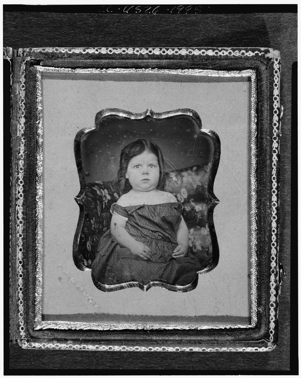 [Adeline Tapley Fuller Stowell, as a girl, three-quarters length portrait, facing front, seated on upholstered sofa], [ca. 1852] — historic photograph