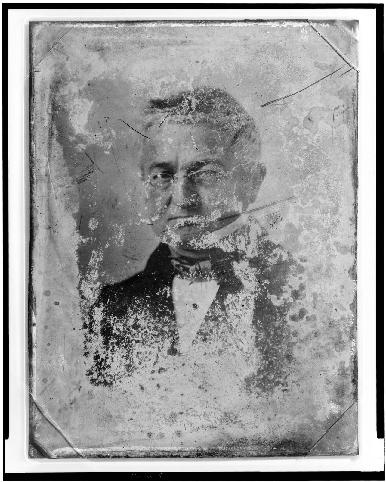 Unidentified man, half-length portrait, damaged daguerreotype plate, 1844 — historic photograph