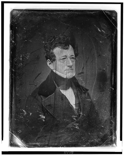Daguerreotype portrait of a man with spectacles and high collar