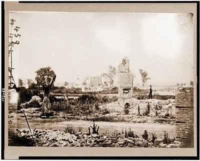Ruins at Hampton Virginia showing chimneys and man standing