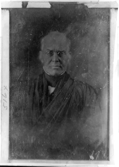 Elderly man with spectacles, half-length portrait
