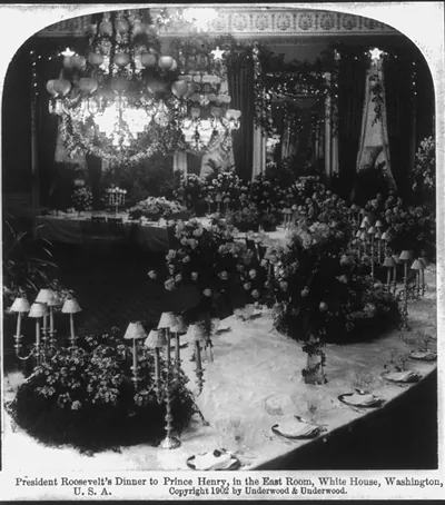 President Theodore Roosevelt's dinner to Prince Henry of Pless, in the East Room, White House [unoccupied, decorated tables]