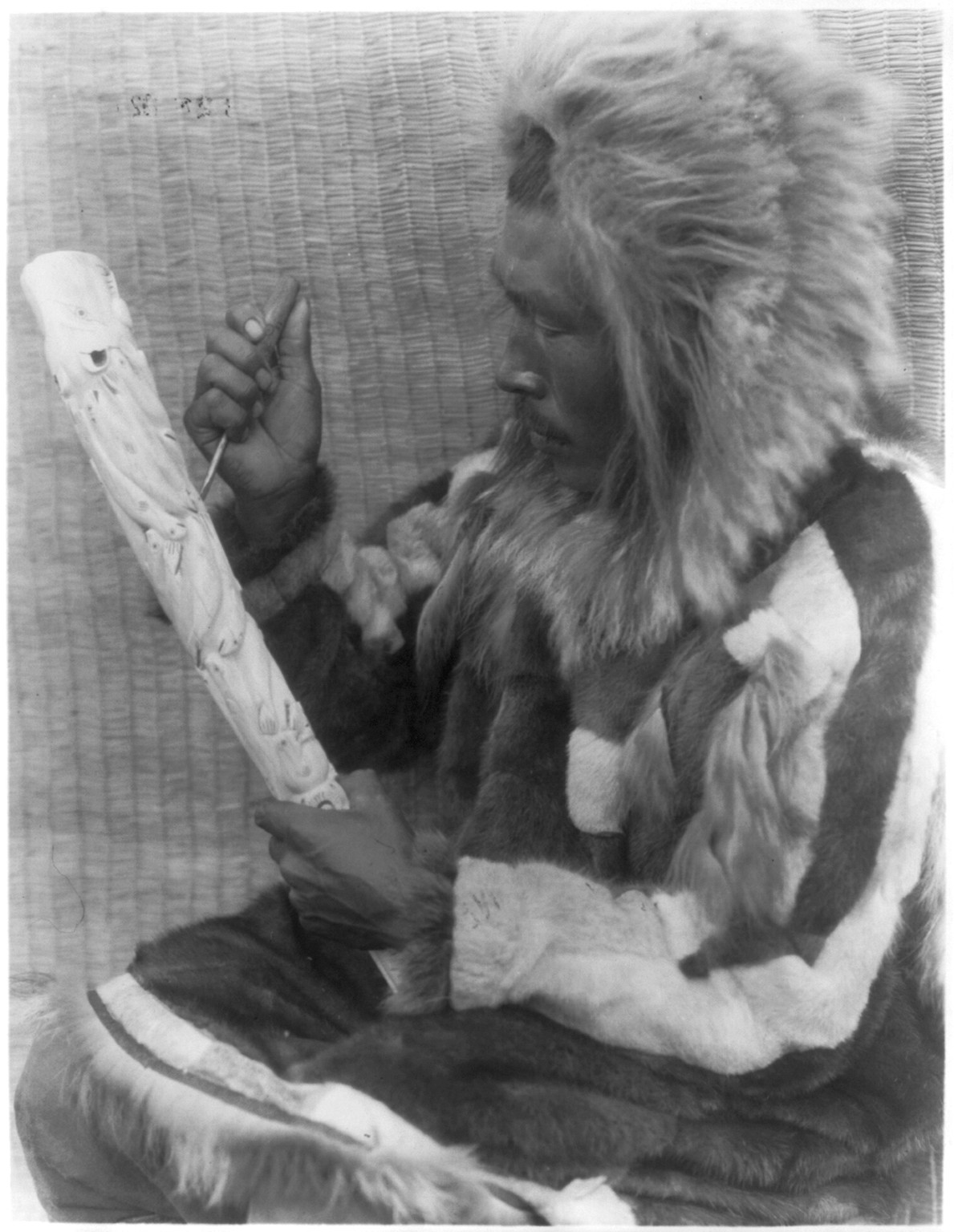 The ivory carver--Nunivak, c1929 February 28. — historic photograph