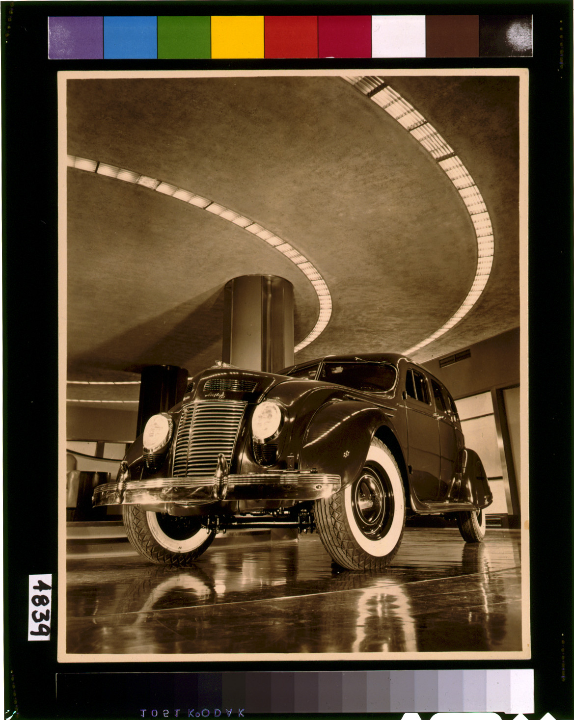 Chrysler Salon, N.Y.C. [1937 Chrysler Airflow four-door sedan in the showroom of the Chrysler Building], [1937] — historic photograph