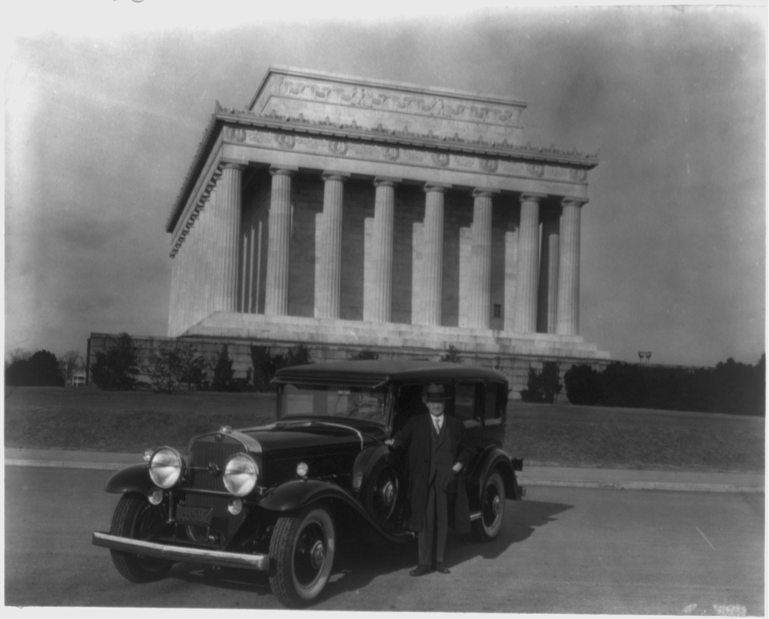 [Man standing with Cadillac near the Lincoln Memorial, Washington, D.C.], 1931 — historic photograph