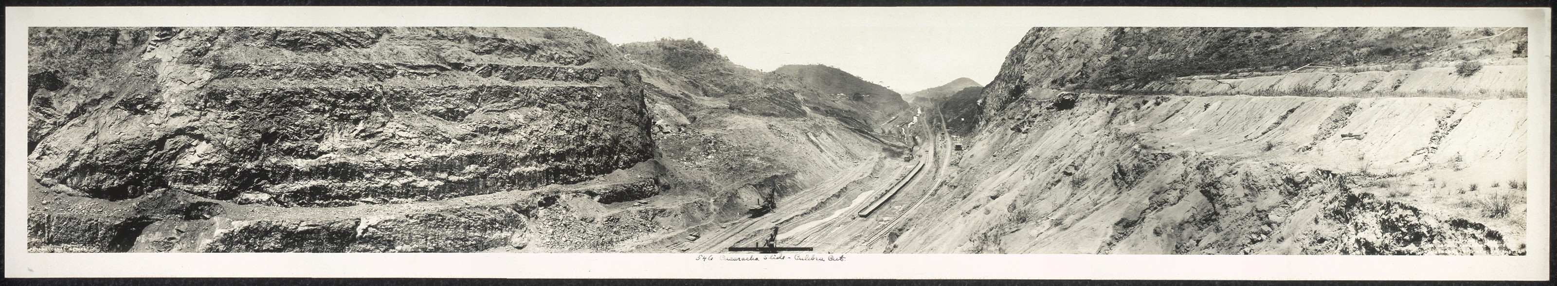 Panoramic view of a rocky railway cut, black and white photograph — historic photograph