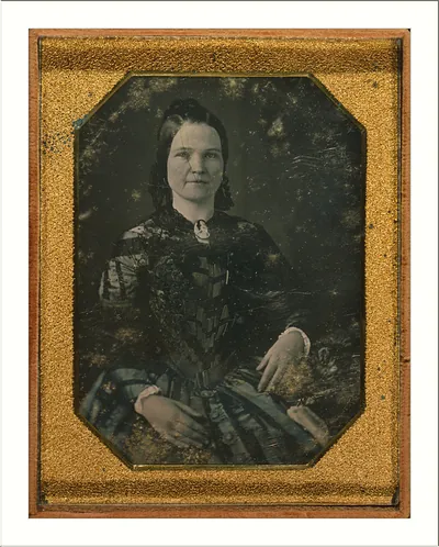 Seated woman portrait in gilt daguerreotype case