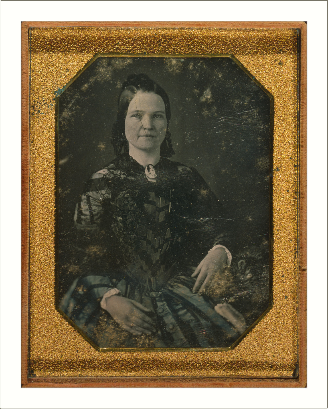 Seated woman portrait in gilt daguerreotype case — historic image