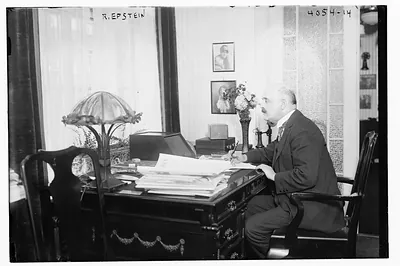 R. Epstein at desk