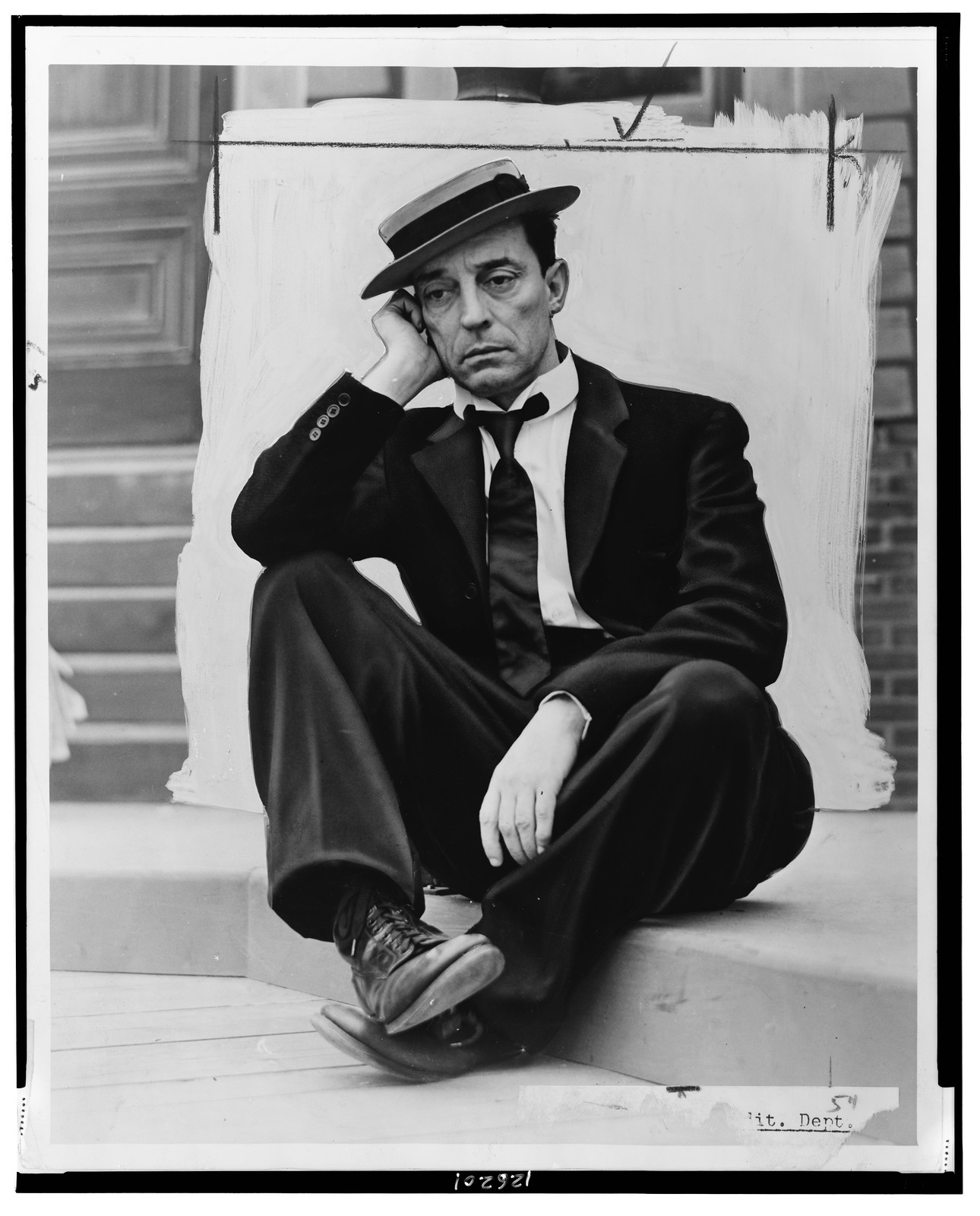 [Buster Keaton, full-length portrait, seated, in costume], 1939 — historic photograph