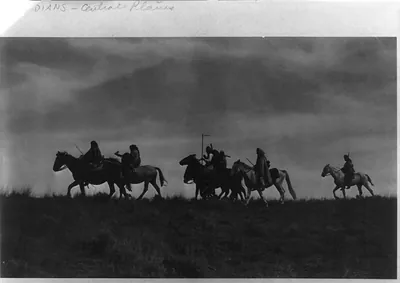 [Indian scouts on horseback passing under cover of night]