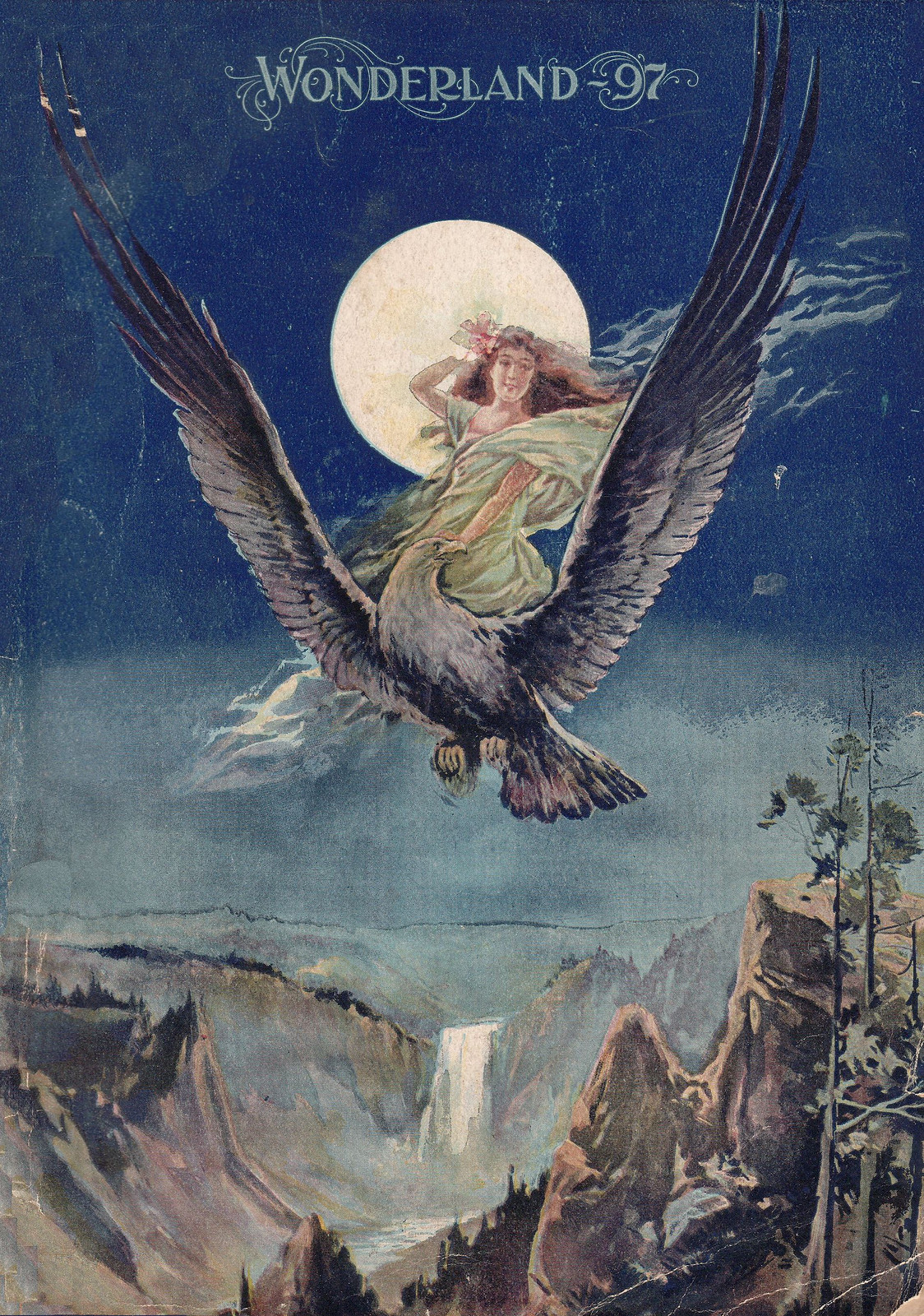 Wonderland 97 cover: woman riding eagle over canyon — historic image