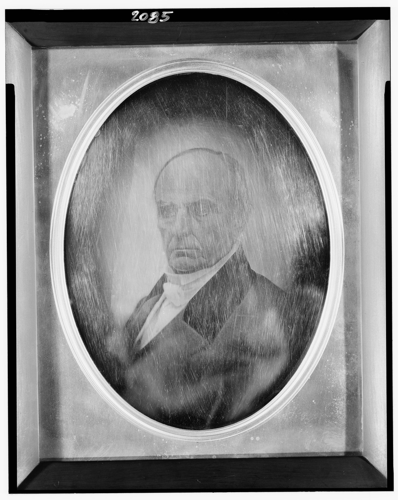 Daguerreotype portrait of an older man in an oval vignette, 1851 — historic photograph
