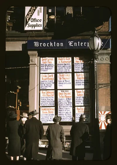 Pedestrians read news bulletins outside Brockton Enterprise office