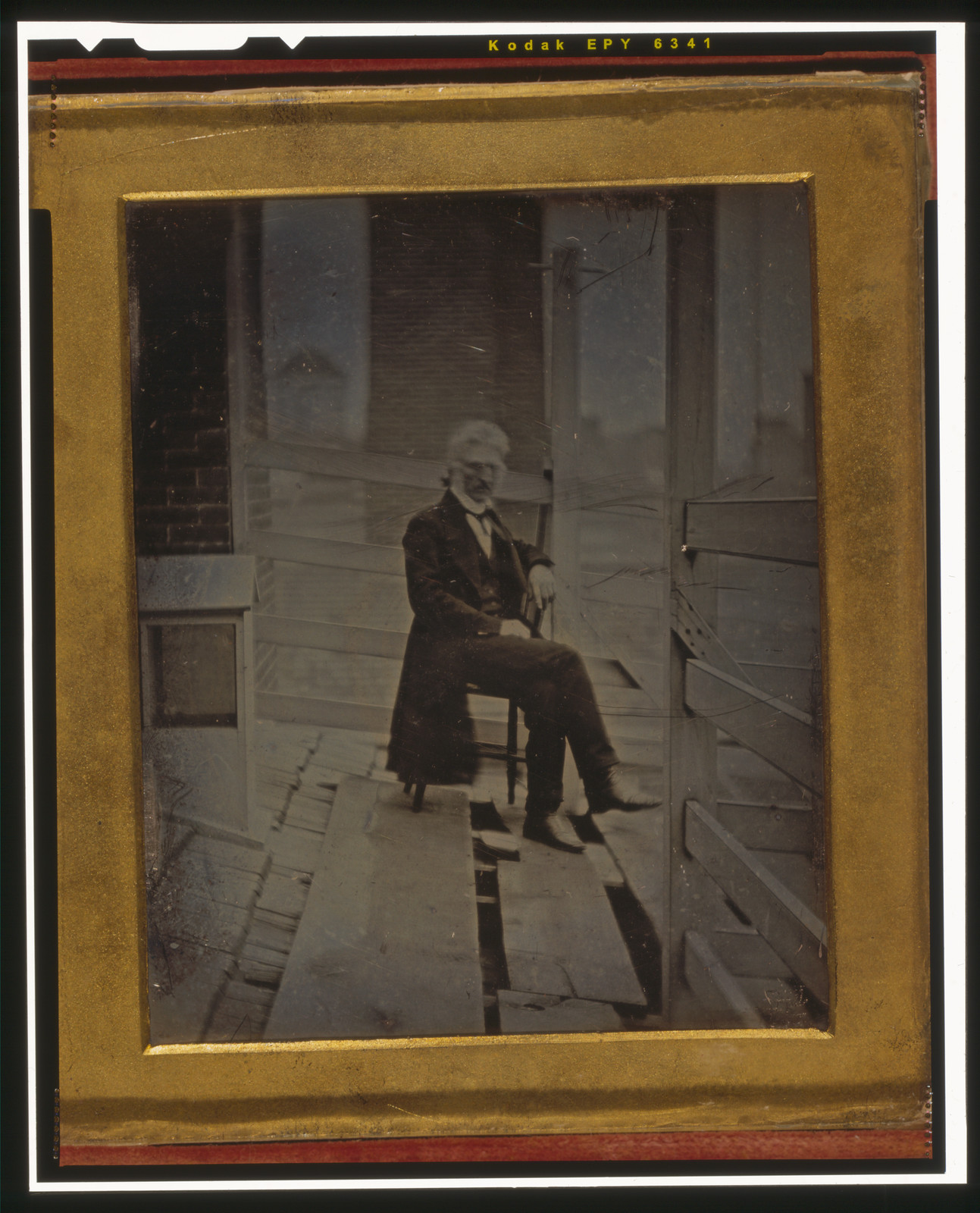 [John McAllister, Jr., full-length portrait, seated in a chair, outdoors on the roof of 48 Chestnut Street, Philadelphia], 1843 — historic photograph