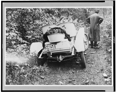 [Automobile stuck in ditch on road in New York]