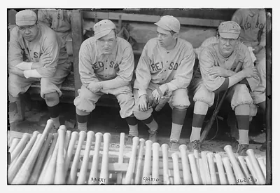 Red Sox players in dugout with bats, Barry and Carrig