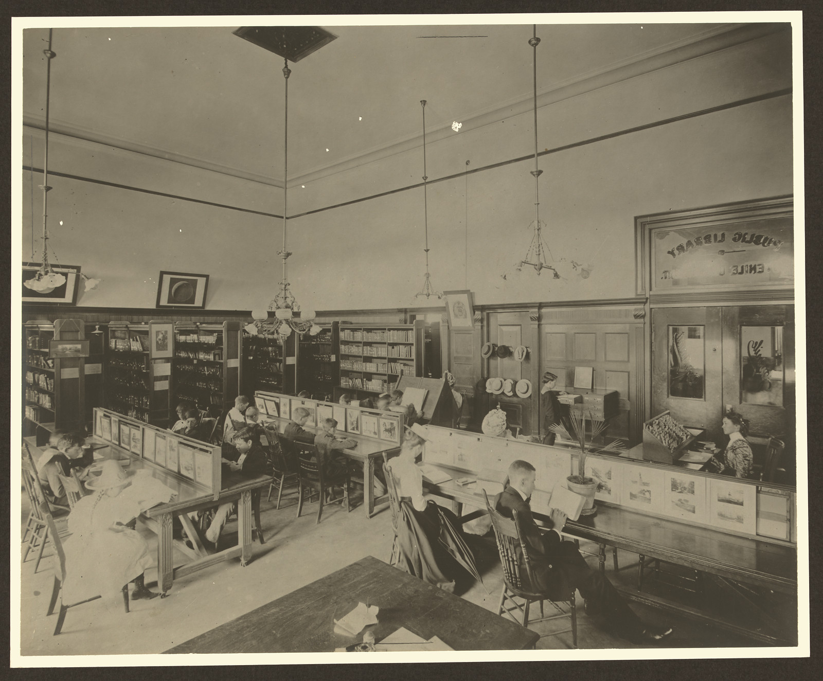 Interior of a public library with readers at long tables — historic image