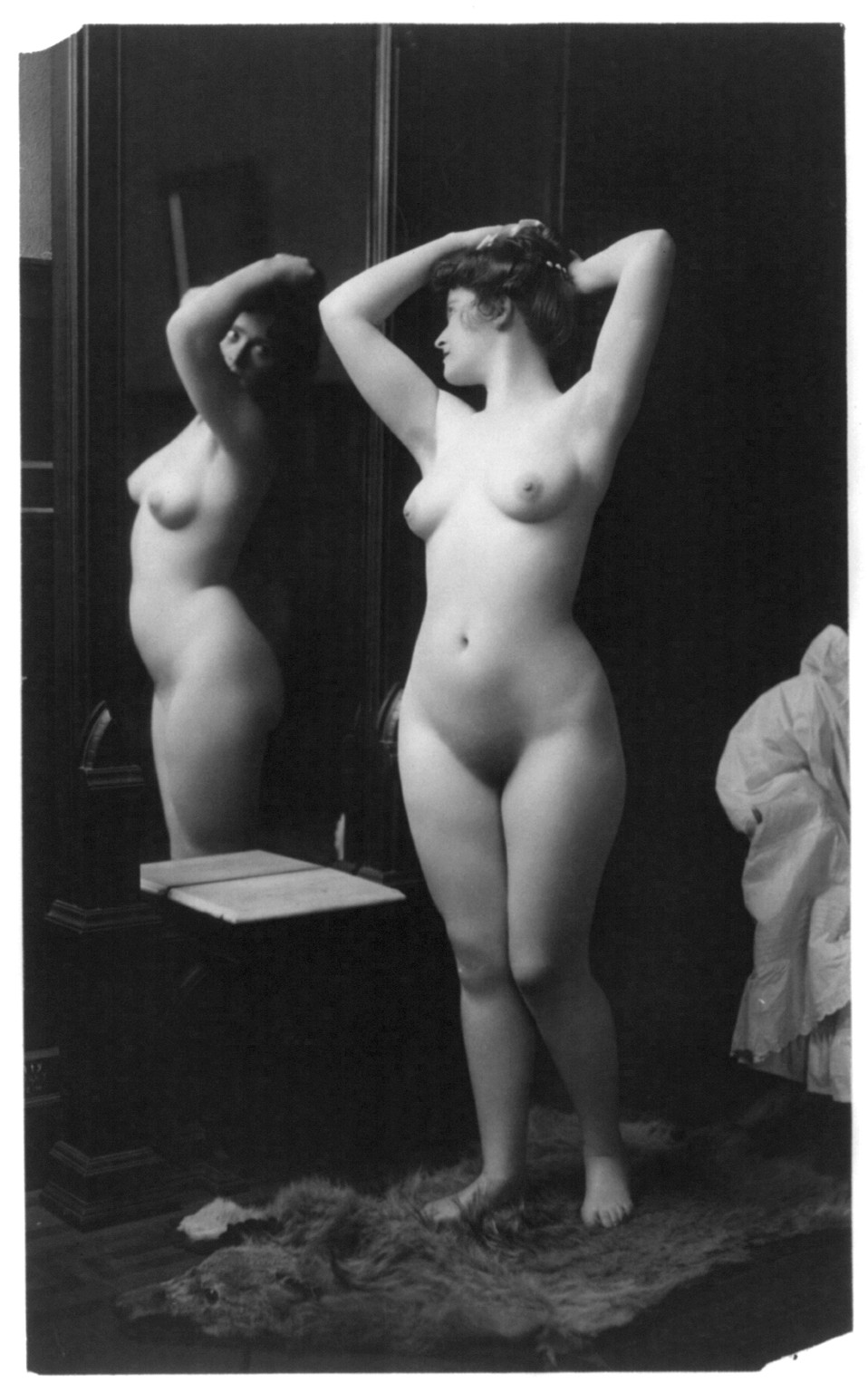 [Young woman modeling: full lgth., nude, looking in mirror], c1902. — historic photograph