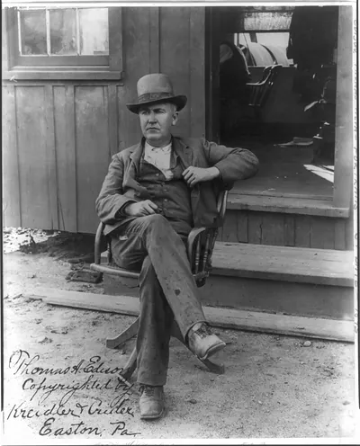 [Thomas Alva Edison, 1847-1931, full-length portrait, seated in swivel chair outside office, facing left]
