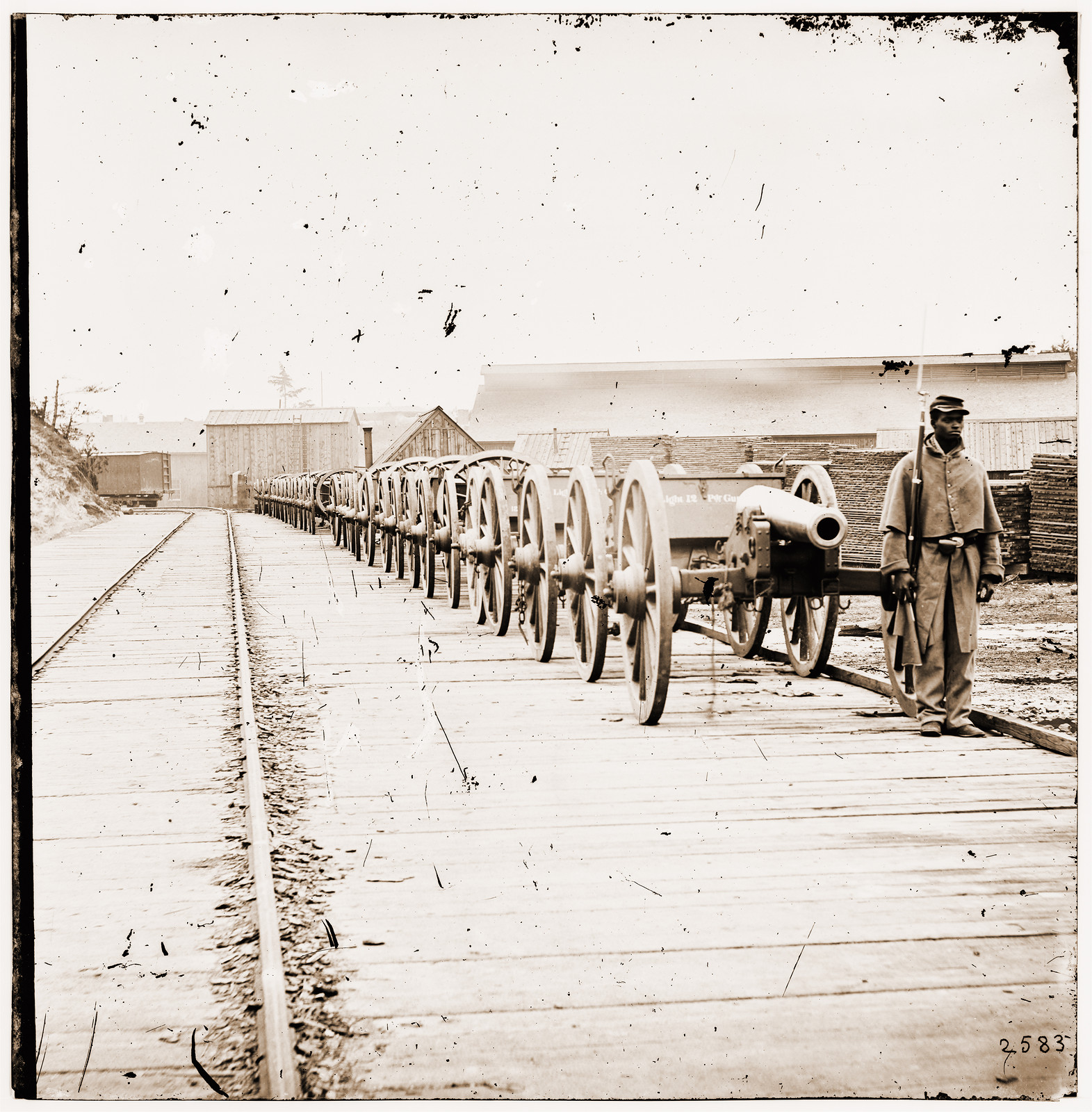 City Point Virginia. Negro soldier guarding 12-pdr. Napoleon. (Model 1857?), 1865 — historic photograph