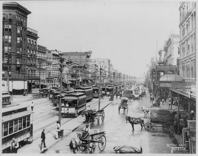 [Louisiana - New Orleans - crowded street scene looking down Canal St.]